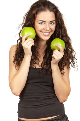 beautiful brunette holding apples apples